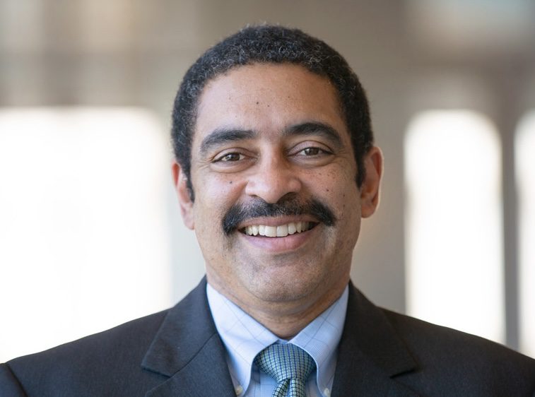 Smiling man with a mustache